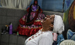Woman taken by a spirit known as Pombagira das Rosas. Members of the Jurema religion make...
