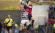 Darren Sweetnam of Munster and George Worth of Leicester jump for the ball during the Euro...