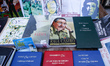 A view of a street stand with Fidel Castro, Raul Castro, Che Guevara and Cuba related book...