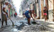 A group of men carry out restauration work on their hause in Havana's center.Since the 24...