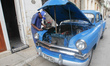 A local mechanic repairs a car outside his house. A typical scene from daily life in Havan...