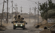 Iraqi forces patrolling the roads of the Assyrian village of Karemlesh, on October 28, 201...