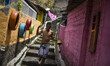A boy is seen playing with a kite. Project to leave the visually pleasing favelas is put i...