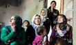 Syrian-Kurdish women wait for a visit from a volunteer doctor.
torbali, Turkey. March 201...