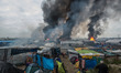 Chaotic scenes of the jungle, after many fires being set up in Calais, France on  26 Octob...