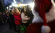 Children having fun at Christmas party with Santa Clause at te centre of the Bulgarian bor...
