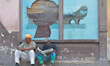 Two men seat on the street in Havana city center. For a week I explored the streets of Ha...