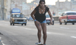 A young lady skateboards seen on Malecon in Havana city center. For a week I explored the...