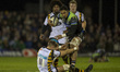 Bundee Aki of Connacht tackled by Josh Bassett of Wasps during the European Rugby Champion...