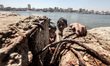 Children playing and learning to swim in the basin in the port of Gaza The mayor warned an...