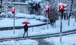 People walk during snowfalls in Istanbul on January 7, 2017. A heavy snowstorm paralysed l...