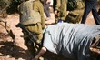 Israeli troops kill a Palestinian "Mohammed Assi" during clashes in the village of Bil'in...
