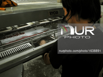 Workers print the ballot papers prepared for the provincial elections across the whole of Indonesia to come in a printing company in Pulogad...