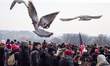 A demonstrator carries a sign during a rally in solidarity with supporters of the Women's...