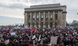 A demonstrator carries a sign during a rally in solidarity with supporters of the Women's...