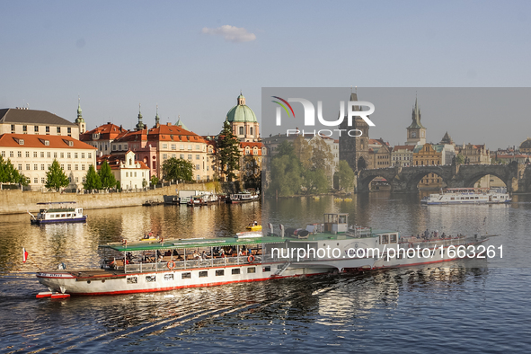 Ship passing  the Vltava river in front of Charles bridge is seen on 1 May 2012 in Prague (Praha) Czech Republic capital.  by Michal Fludra/NurPhoto