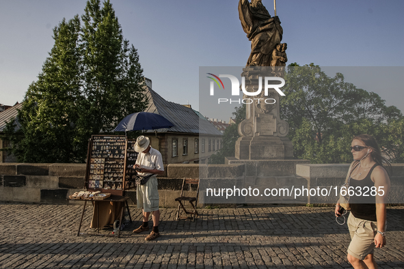 People walking at the Charles bridge are seen on 1 May 2012 in Prague (Praha) Czech Republic capital.  by Michal Fludra/NurPhoto