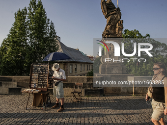 People walking at the Charles bridge are seen on 1 May 2012 in Prague (Praha) Czech Republic capital.  by Michal Fludra/NurPhoto