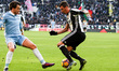 Juventus forward Mario Mandzukic (17) vies with Lazio defender Patric (4) during the Serie...