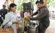 Cambodian migrant workers are fed by the Thai military before they cross the border and re...