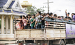 Migrant Cambodians working in Thailand are transferred to the border by Immigration Police...