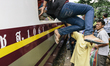 Cambodian migrants arrive by train at Aranyapathet Railway Station in Thailand before cros...
