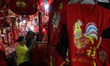 Indonesians Chinese ethnic purchase ornaments ahead of the Lunar New Year at a market stal...