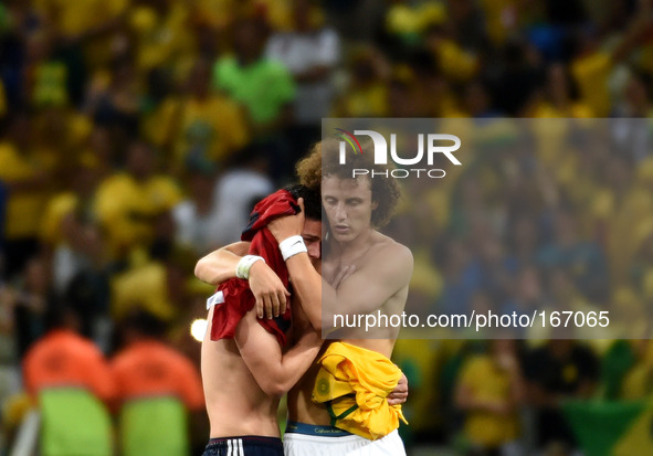(140704) -- FORTALEZA, July 4, 2014 () -- Brazil's David Luiz (R) comforts Colombia's James Rodriguez after a quarter-finals match between B...