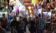 People buing goods at the souk at medina near Jamaa el-Fna square are seen on 14 November...
