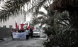 Bahrain , Abu Saiba - protesters rasing Bahrain flags in the demonstration , demonstration...