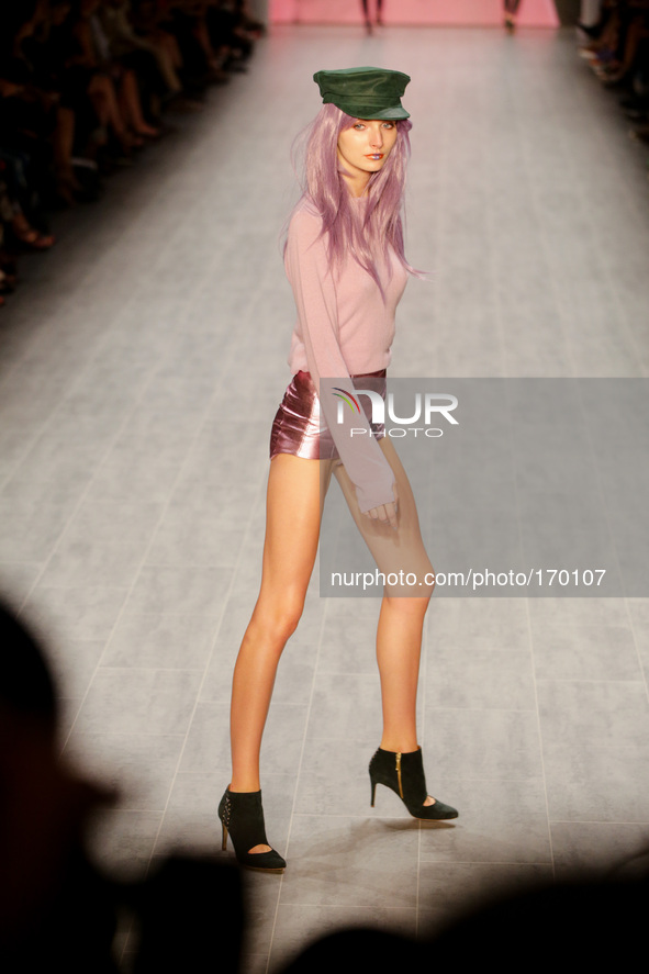 Model walks on catwalk during the 'C'est tout/Ce'nou Show' during the Fashion Week Berlin on July 07, 2104 in Berlin, Germany 