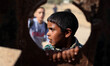 Palestinian boys look scene of an Israeli air strike in the northern Gaza Strip October 28...