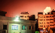 Smoke billows from buildings following an Israeli air strike in Gaza Strip, on July 9, 201...