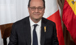 French Republic Francois Hollande sits before holding a meeting at the city hall during th...