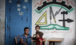 Palestinian people inside United Nations Relief and Works Agency (UNRWA) on July 18, 2014...