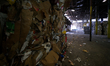 Bales of cardboard, paper and plastics are stacked up high at the end of the process at th...