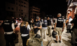 Journalists gather in front of Al Deira hotel after most of the so called Beach Hotels in...