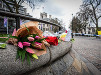 Floral tributes are seen near a police cordon in Westminster in London, on March 23, 2017. Police continue investigations after the terror a...
