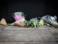 Floral tributes are seen near a police cordon in Westminster in London, on March 23, 2017.  Police continue investigations after the terror...