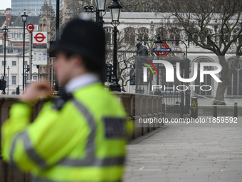 A police officer in front of Westminster Station in London, on March 23, 2017. Police continue investigations after the terror attack in Lon...