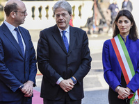 The Mayor of Rome, Virginia Raggi, right, stands with Italian Prime Minister Paolo Gentiloni, center, and Italian Foreign Minister Angelino...