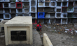 A boy defecates in a vacant lot inside the cemetery in Carreta Cemetery on 27 March 2017....