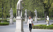 A woman is seen walking throught the Ogrod Saski park while talking on the phone on 11 Apr...