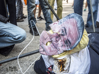 A puppet of Brazilian President Michel Temer received kicks, punches and thrusts by a group of protesters at in Sao Paulo, Brazil on April 1...