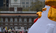 Ten-foot tall "Chicken Don" sits on the bed of a pickup truck at a April 15, 2017 Tax Day...