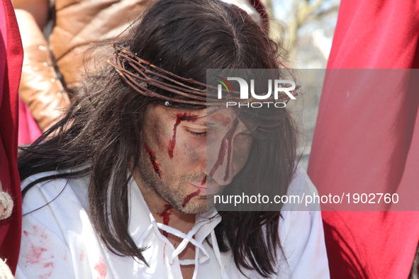 A participant playing the role of Jesus Christ during the Good Friday procession in Little Italy in Toronto, Ontario, Canada, on April 14, 2...