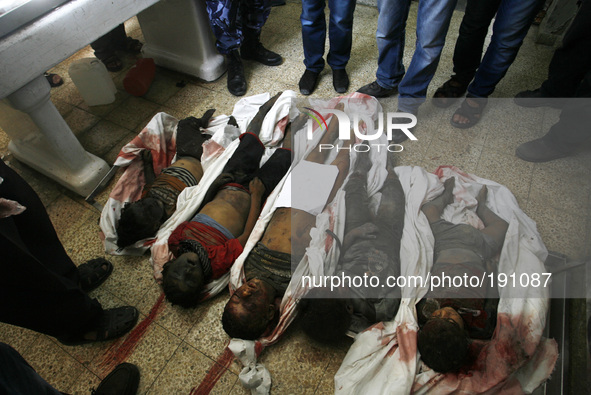 The bodies of Palestinian children from the family-Najjar, in the hospital morgue after a an Israeli air strike on their house was killed 18...