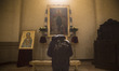 Man prays in St. George's Cathedral in Lviv on April 21, 2017.  Lviv is the largest city i...