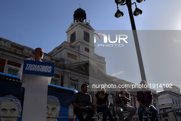A man speaks as the 'Tramabus,' an anti-corruption bus belonging to the Spanish opposition party Podemos, makes a stop at Puerta del Sol in...