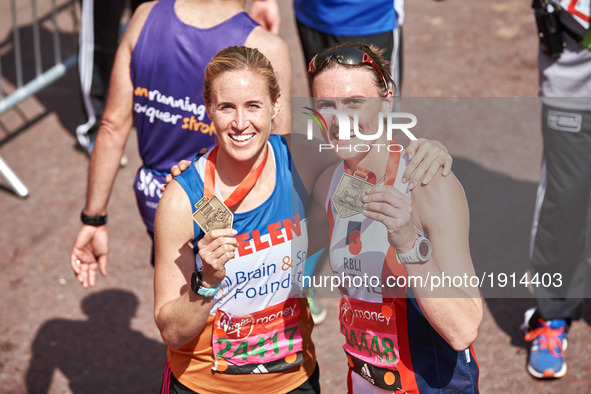 Helen Glover (L) and Heather Stanning pose for a photo after completing the Virgin London Marathon on April 23, 2017 in London, England.  